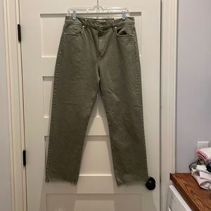 Olive green high rise straight cropped pants with unfinished hem.